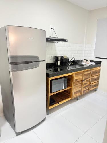 a stainless steel refrigerator in a kitchen at Flats Ana Alves Residence Delta do Parnaíba- Piauí in Parnaíba