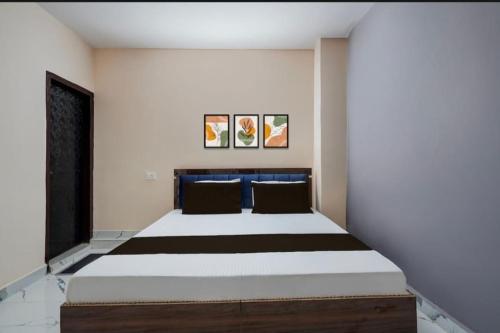 a bedroom with a large bed in a room at Park's Hotel Mbd in Morādābād