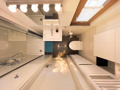 a large room with a glass floor and a skylight at Moderne Ferienwohnung Deichstrasse in Hennef