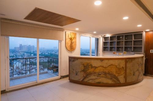 a kitchen with a large tub in the middle of a room at Hibiscus Elite Hotel in Greater Noida