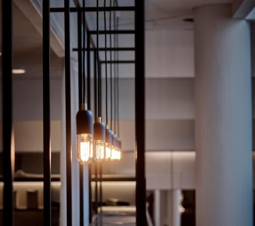 a chandelier hanging from the ceiling in a room at Thon Partner Hotel Høje Taastrup in Tåstrup