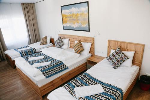 a hotel room with two beds at Apple Hostel Bishkek in Bishkek