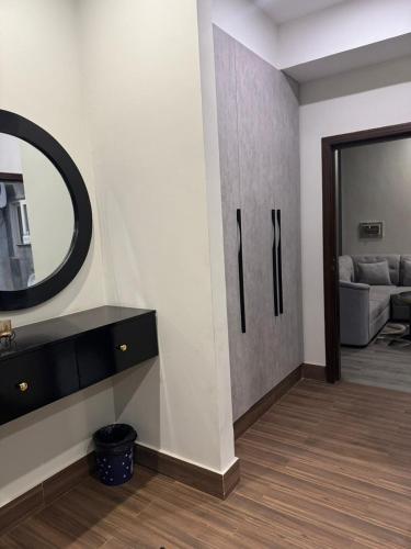 a living room with a mirror on the wall at Seven Star Heights in Rawalpindi