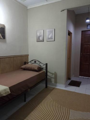 a bedroom with a bed in a room at Tipika Room Pasir Pekan in Tumpat