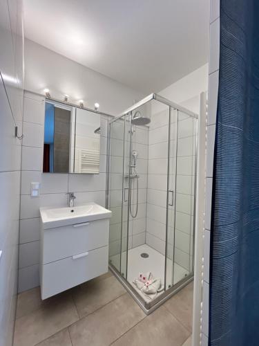 a bathroom with a shower and a sink at Pension Neuhof in Ossiach
