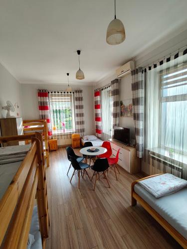 a living room with a table and chairs at Torino in Zator
