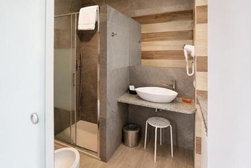 a bathroom with a sink and a shower at VillaCuore in Tavernerio