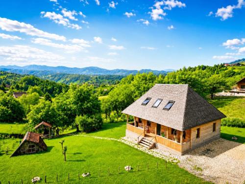an overhead view of a house on a green field at Casa WEZLY in Măgura