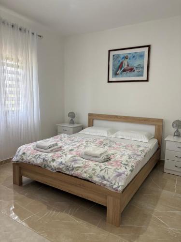 a bedroom with a bed in a room at B&B Ana in Virpazar