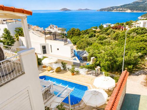 a villa with a swimming pool and a view of the ocean at VILLA LEDA MARE KALKAN Sea View, Private Pool & Beach Clubs in Kalkan