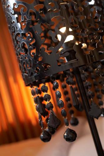 a bunch of black puzzle pieces on a wine rack at Weekend Boutique Hotel in Chişinău