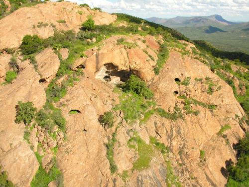 an aerial view of a rocky mountain with trees on it at Ai Aiba - The Rock Painting Lodge in Omaruru