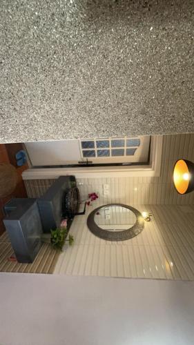 a view of a living room with a table and a circle in the floor at شاليه in Al Bukayriyah