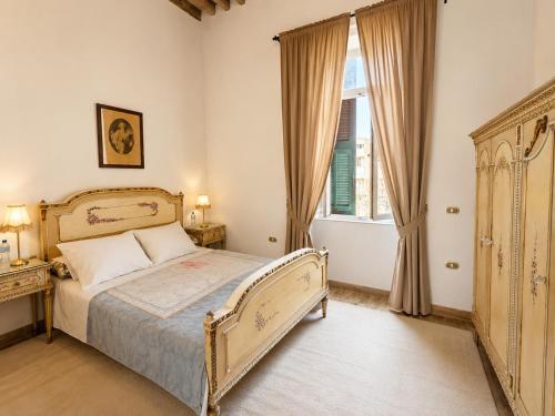 a bedroom with a bed and a window at 7 Heaven in Alexandria