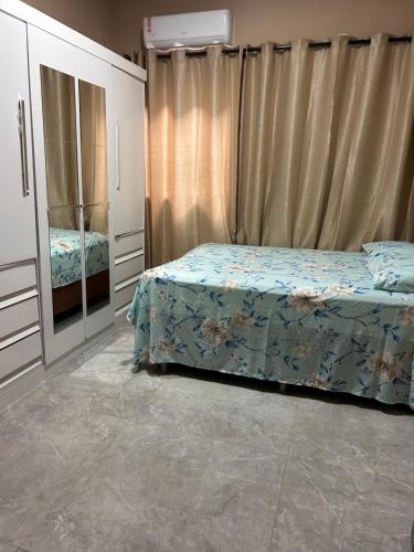 a bedroom with a bed and a dresser at Casa Morada Nobre2 in Barreirinhas