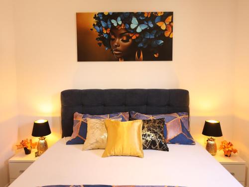a bedroom with a bed with a black headboard at Apartman Boki in Bileća