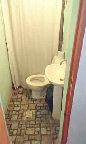 a bathroom with a toilet and a sink at maimareña in Maimará