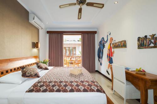 Posteľ alebo postele v izbe v ubytovaní Sandat Bali Ubud