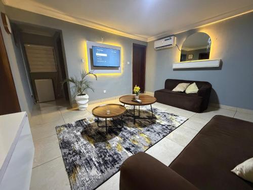 a living room with a couch and a table at Max Horizon in Ikeja