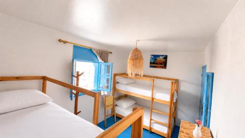 a bedroom with a bunk bed and a bunk ladder at Coast anza house in Agadir