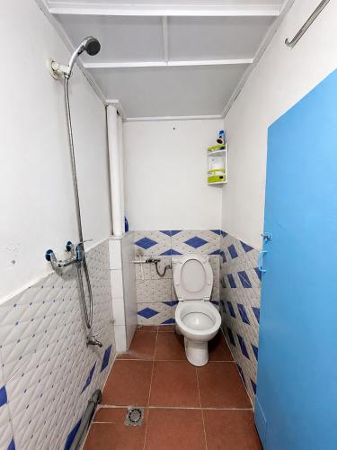 a bathroom with a toilet and a shower at Coast anza house in Agadir