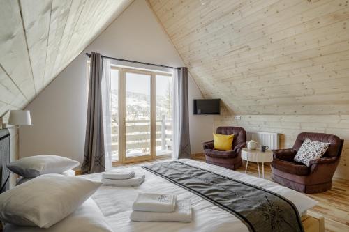 Posteľ alebo postele v izbe v ubytovaní Tatra Wood House