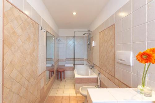 a bathroom with a toilet and a sink and a tub at Tenuta Mocajo in Guardistallo