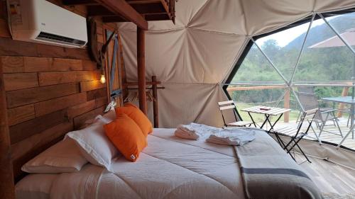 a bedroom with a large bed in a tent at Alma Lemu Lodge in Los Ladrillos