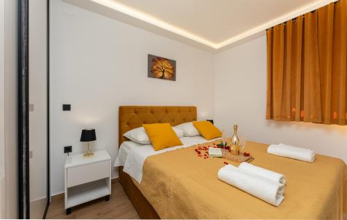 a bedroom with two beds with yellow pillows at Top View Biograd in Biograd na Moru