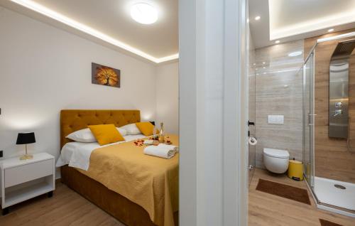 a bedroom with a bed and a glass shower at Top View Biograd in Biograd na Moru