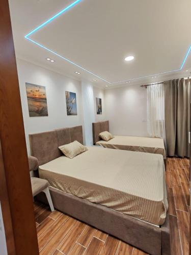 a bedroom with two beds and a window at LuXURY STUDIOS MATROUH 3 in Marsa Matruh