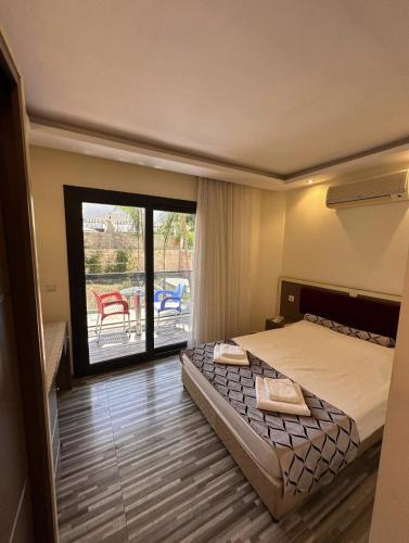 Krevet ili kreveti u jedinici u okviru objekta Hotel Falcon Home