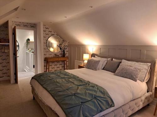 a bedroom with a large bed in a room at Nanny lane loft in Church Fenton