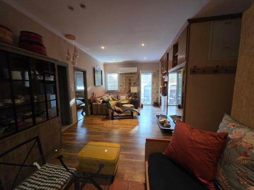 a living room with a couch and a table at Homeric poems Suites in Chios