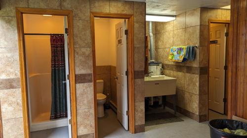 a bathroom with a toilet and a sink at Ouachita Campground at Edendell in Oden