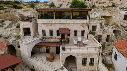 an aerial view of a building on a mountain at Kayaharman cave otel in Nar