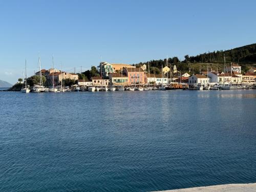 a large body of water with boats in a harbor at Μαργαρίτα 1 in Fiskardo