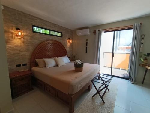 a bedroom with a large bed and a large window at Private House with Pool, 2 Bedrooms & Parking in Valladolid