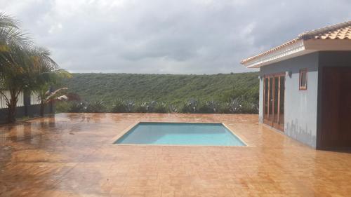 a swimming pool in front of a house at Great Hill View Apartment in Grote Berg