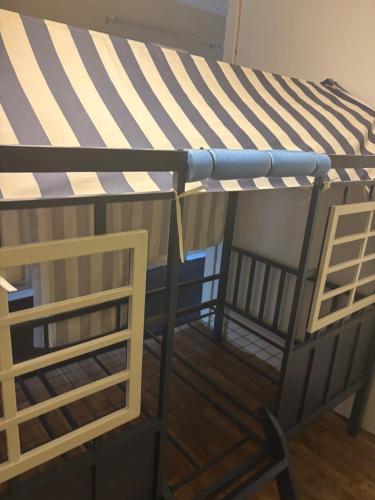 a bunk bed with a blue and white canopy at Pixie hollow single vacation retreat resort space in Orlando