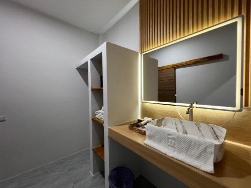 a bathroom with a sink and a mirror at Wilawan home in Ko Samui
