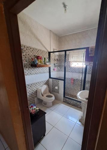 a bathroom with a toilet and a sink at Berlin Ridge in Berlin