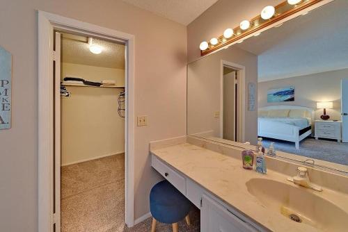 a bathroom with a sink and a large mirror at Siesta Key Beach - 2 Bedroom - 3 Beds - 3 Bathroom Duplex with Heated Swimming Pool in Siesta Key