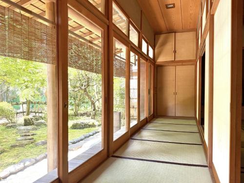 a hallway of a house with large windows at ccb hotel 90Minutes from Tokyo in Chichibu