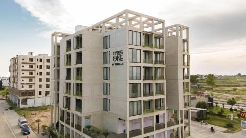 an apartment building with the words ones one at Cyrus One By Trivelles in Islamabad