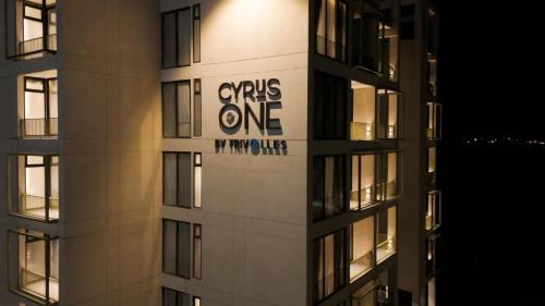 a building with a sign on the side of it at Cyrus One By Trivelles in Islamabad