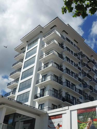 a large white apartment building with balconies at Condo Unit at One Pontefino Tower Unit 706 in Batangas City