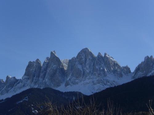 a view of a mountain range with snow at Hotel Gsoihof in Villnoss