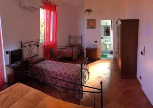 B&B Villa zia Febronia tesisinde bir odada yatak veya yataklar