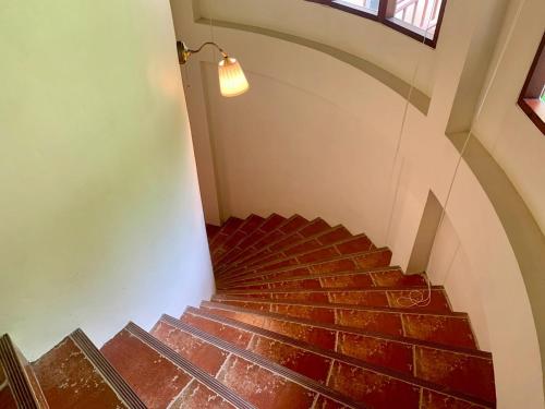 a staircase with red bricks and a light at Chivapuri Beach Resort in Ko Chang